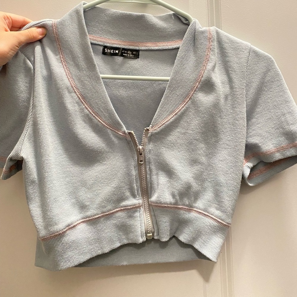 Plunging front zip up puff sleeve crop top